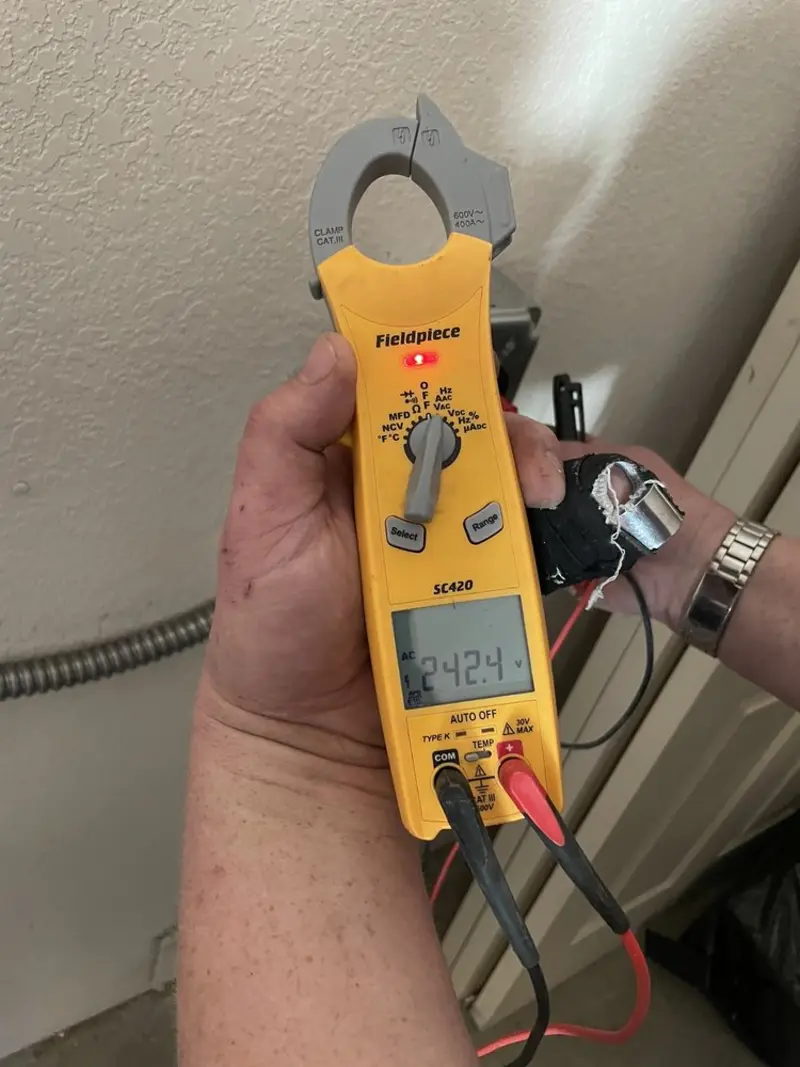 Voltage testing with clamp meter during Whole House Surge Protector in Cottage Lake